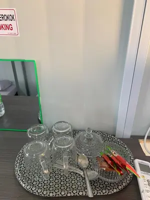 a tray with glasses and spoons on a table at Farhani Cabin Stay in Kampong Batu Lima