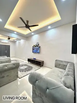 a living room with two couches and a ceiling fan at SFS Family Homestay Kulim in Kulim