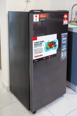 a refrigerator with a sign on the side of it at The Sun Executive #BayanLepas #QueensbayMall #8 in Bayan Lepas