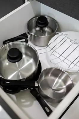 a stove with three pots and pans on it at The Sun Executive #BayanLepas #QueensbayMall #13 in Bayan Lepas