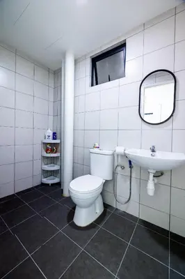 a bathroom with a toilet and a sink at The Sun Executive #BayanLepas #QueensbayMall #13 in Bayan Lepas