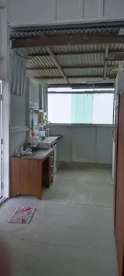 an empty kitchen with a sink and a counter at Bukit Limau rest house Merbau in Taiping