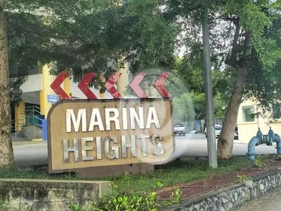 a sign for a marina heights sign in front of a building at Marina Heights Home Suite Teluk Batik in Lumut