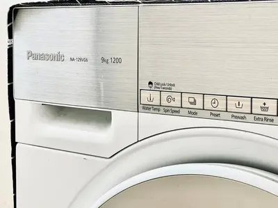 a close up of a toilet with a microwave at 2BR LaPrimo Homestay Bandar Meru Raya Ipoh in Ipoh