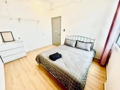 a bedroom with a bed and a dresser at 2BR LaPrimo Homestay Bandar Meru Raya Ipoh in Ipoh