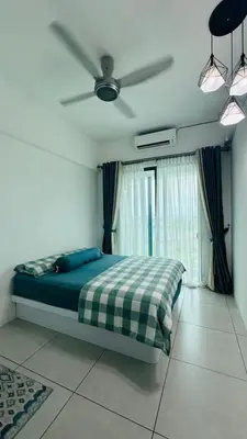 a bedroom with a bed and a ceiling fan at Meritus - Perai in Perai