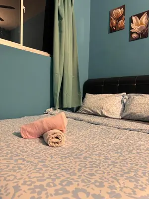 a bedroom with a bed with a towel on it at skyview relax 2BR 1car park arenaspice airport domestic guest only in Bayan Lepas