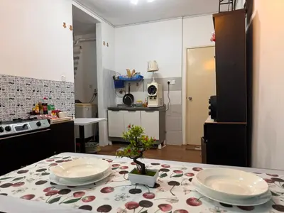 a kitchen with a table with plates on it at skyview relax 2BR 1car park arenaspice airport domestic guest only in Bayan Lepas