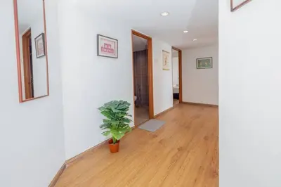 a hallway with a potted plant in a room at Sri Sayang at Batu Feringghi Beach by Plush in Ayer Itam