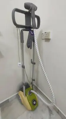 a vacuum is hooked up to a wall at 66 Homestay 5 Min to Leaning Tower in Teluk Intan