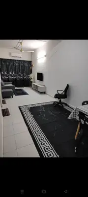 a living room with a couch and a chair at Mom House in Ipoh