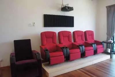 a group of red chairs in a living room at Tranquil lake view retreat \u601d\u6e56\u8336\u5c4b in Ipoh