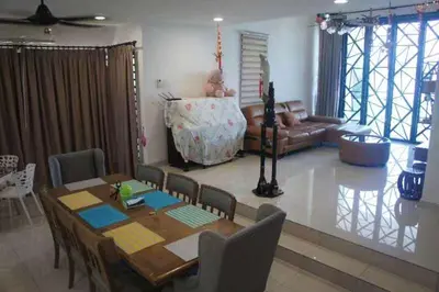a living room with a table and a couch at Tranquil lake view retreat \u601d\u6e56\u8336\u5c4b in Ipoh