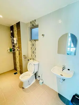 a bathroom with a toilet and a sink at Ipoh Town Anderson Hani Suite 4paxs 1R1B in Ipoh