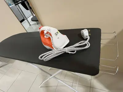 a black table with a phone on top of it at Ipoh Town Anderson Hani Suite 4paxs 1R1B in Ipoh