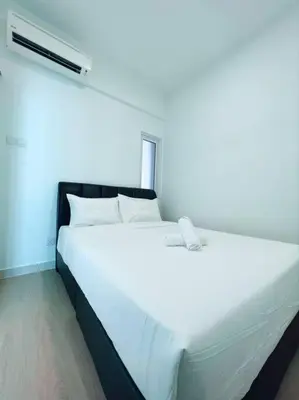 a large white bed in a room with a window at Maritime Suite Duplex 3Bedroom at George Town by Uptrend Home Management in George Town