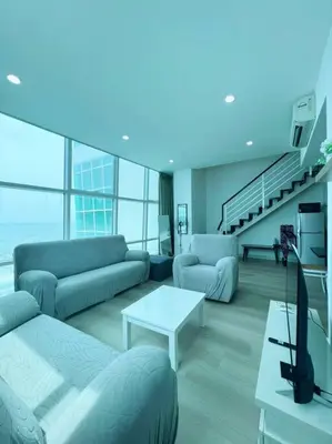 a living room with a couch and a tv at Maritime Suite Duplex 3Bedroom at George Town by Uptrend Home Management in George Town