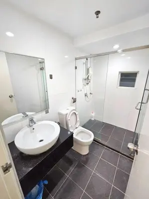 a bathroom with a sink and a toilet and a shower at Maritime Suite Duplex 3Bedroom at George Town by Uptrend Home Management in George Town
