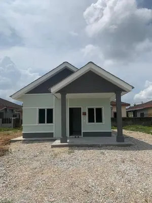 a small house is shown with a driveway at HomeStay Damia in Teluk Intan