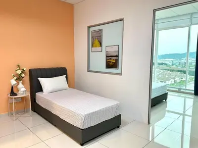 a small bed in a room with a window at Superb Airport 2BR Suite# Straits Intl# MsgChair in Bayan Lepas