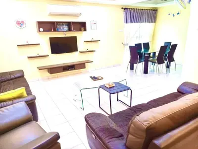 a living room with a couch and a tv and chairs at Lavender Homestay Tanjung Malim in Tanjung Malim