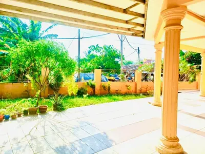 a porch with a column and a view of a yard at Lavender Homestay Tanjung Malim in Tanjung Malim