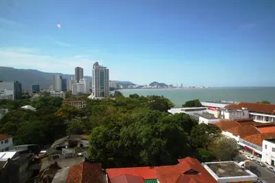 a city with a view of the water and buildings at Hotel Malaysia in George Town