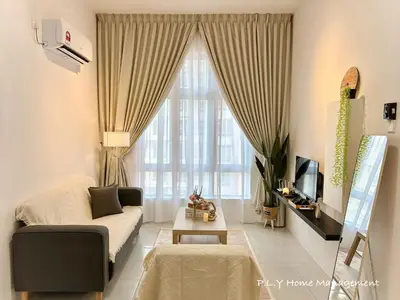 a living room with a couch and a large window at The Anderson Condo by PLY Home in Ipoh