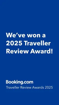 a blue sign that says weve won a traveler review award at feelslikehome Paloh Residence Ipoh-for 4 to 6pax in Ipoh