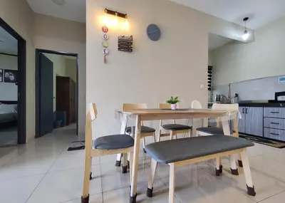 a kitchen and dining room with a table and chairs at feelslikehome Paloh Residence Ipoh-for 4 to 6pax in Ipoh