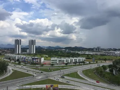 a highway in a city with buildings and traffic at The Rain Homestay Meru Raya in Ipoh