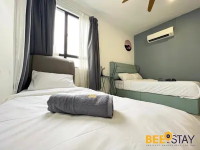 a bedroom with two beds and a window at Ipoh City Centre Manhattan Condo Pool View NEW Unit in Ipoh