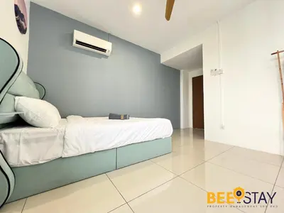a bedroom with a bed with a blue wall at Ipoh City Centre Manhattan Condo Pool View NEW Unit in Ipoh