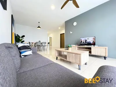 a living room with a couch and a tv at Ipoh City Centre Manhattan Condo Pool View NEW Unit in Ipoh