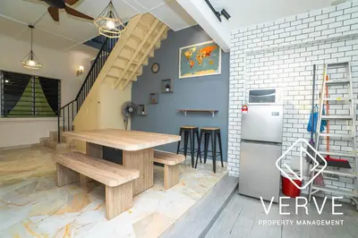 a kitchen with a wooden table and a refrigerator at Ipoh Hillview Boutique Guesthouse by Verve 10 pax in Ipoh