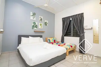a bedroom with a white bed and a window at Ipoh Hillview Boutique Guesthouse by Verve 10 pax in Ipoh