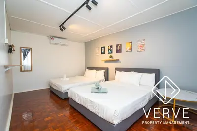 two beds in a room with white walls at Ipoh Hillview Boutique Guesthouse by Verve 10 pax in Ipoh