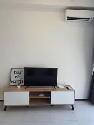 a living room with a television on a table at Urban Suites Penang P2 LDL WL in Jelutong