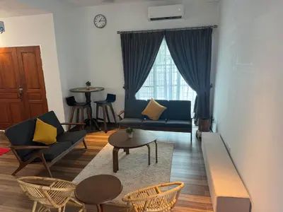 a living room with a couch and chairs and a table at Jambul Villa 3-storey corner House 6Bed5Bathroom in Bayan Lepas