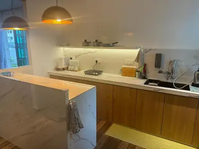 a kitchen with a sink and a counter top at Jambul Villa 3-storey corner House 6Bed5Bathroom in Bayan Lepas