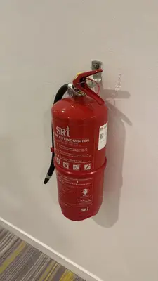 a red fire hydrant is hanging on a wall at Jambul Villa 3-storey corner House 6Bed5Bathroom in Bayan Lepas
