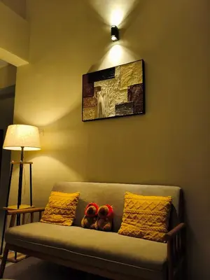 a couch with two teddy bears sitting on it at Penthouse with 3 bedrooms, Golden Hills Night Market in Brinchang