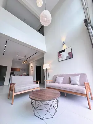 a living room with two couches and a table at Penthouse with 3 bedrooms, Golden Hills Night Market in Brinchang