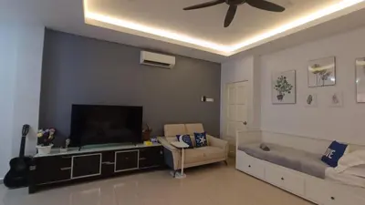a living room with a flat screen tv and a couch at Lenggong GEM 16 Homestay in Kampong Ulu Jepai