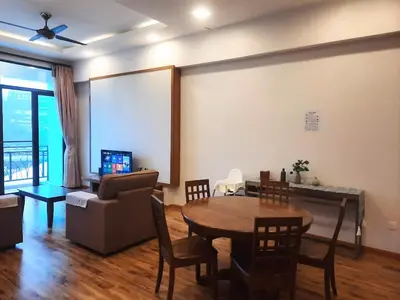 a living room with a table and a couch at Keafarm Highland Breeze in Brinchang