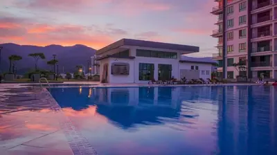 a large swimming pool in front of a building at IPOH Apartmen Casa Kayangan Meru, Meru Raya 5 Ipoh Homestay in Ipoh