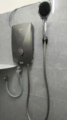 a blow dryer is hooked up to a wall at 77 homestay 5Min to Leaning Tower in Teluk Intan