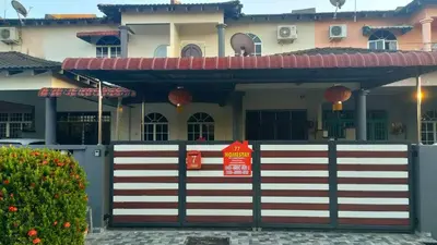 a house with a gate with a sign on it at 77 homestay 5Min to Leaning Tower in Teluk Intan