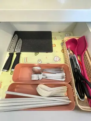 a drawer filled with utensils and a tray with a utensil at G Home 1 - Ipoh City Center Majestic 2R2B in Ipoh