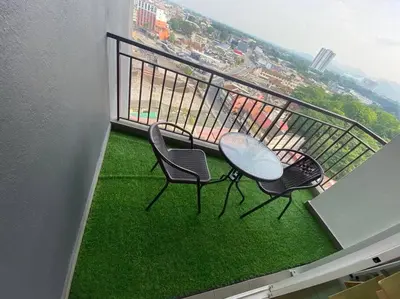 two chairs and a table on a balcony at G Home 1 - Ipoh City Center Majestic 2R2B in Ipoh